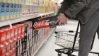A shopper takes a case of Coca-Cola Co. Zero soft drinks at a store in Orem, Utah, U.S., on Tuesday, Feb. 9, 2021. Coca Cola is scheduled to announce their fourth-quarter 2020 earnings tomorrow February 10. Coca-Cola Co.'s sales beat Wall Street's expectations in the fourth quarter, giving the soda maker a boost after nearly a year of global lockdowns at restaurants, amusement parks and stadiums that have disrupted its business. Photographer: George Frey/Bloomberg