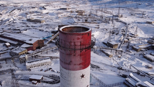 A chimney of the closed JSC Kola Mining & Metallurgical Co (Kola MMC) copper smelting shop, a unit of MMC Norilsk Nickel PJSC, in this aerial photograph taken in Nikel, Russia, on Friday, Feb. 26, 2021. Russia’s Norilsk Nickel shut its oldest copper smelter as part of an environmental program, amid mounting pressure for metals producers to clean up their aging and dirtiest operations. Photographer: Andrey Rudakov/Bloomberg