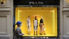A shopper wearing a protective face mask walks by a Prada SpA store at the GUM luxury department store in Moscow, Russia, on Monday, June 1, 2020. With Russia's economic activity declining by a third during a two-month nationwide lockdown to limit the spread of the coronavirus epidemic, the Kremlin is now seeking to limit the fallout.