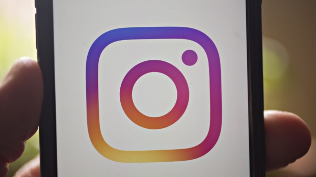 The Facebook Inc. Instagram logo is displayed on an Apple Inc. iPhone in an arranged photograph taken in Arlington, Virginia, U.S. on Monday, April 29, 2019. Facebook's sales gains are increasingly being driven by photo-sharing app Instagram and advertising in its Stories feature, a Snapchat copycat.