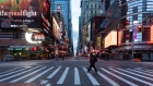 A pedestrian crosses a nearly empty street in the Times Square neighborhood of New York, U.S., on Wednesday, April 1, 2020. New York reported almost 400 new coronavirus fatalities overnight, pushing up the state's death toll from the outbreak to almost 2,000, Governor�Andrew Cuomo�said Wednesday. Photographer: Jeenah Moon/Bloomberg