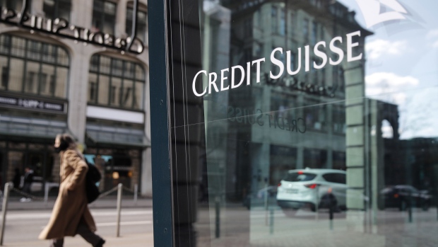 A Credit Suisse logo in a window of the Credit Suisse Group AG headquarters in Zurich, Switzerland, on Thursday, April 8, 2021. Credit Suisse Chief Executive Officer Thomas Gottstein gathered dozens of managing directors at the global bank on a conference call late Tuesday, as part of crisis-management efforts after the lender announced that it stands to lose as much as $4.7 billion amid the meltdown of hedge fund Archegos Capital Management. Photographer: Stefan Wermuth/Bloomberg