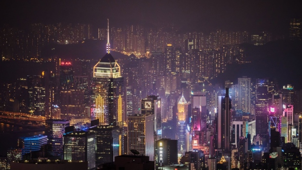 Buildings are seen from Victoria Peak at night in Hong Kong, China, on Wednesday, Aug. 28, 2019. Hong Kong's hotel industry is struggling with a collapse in bookings after thousands of protesters shut down flights from the territory's airport in an escalation of months of clashes with police. Photographer: Paul Yeung/Bloomberg