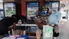 A vendor prepares cotton candy for a customer at a food stand in Myrtle Beach, South Carolina. Photographer: Micah Green/Bloomberg