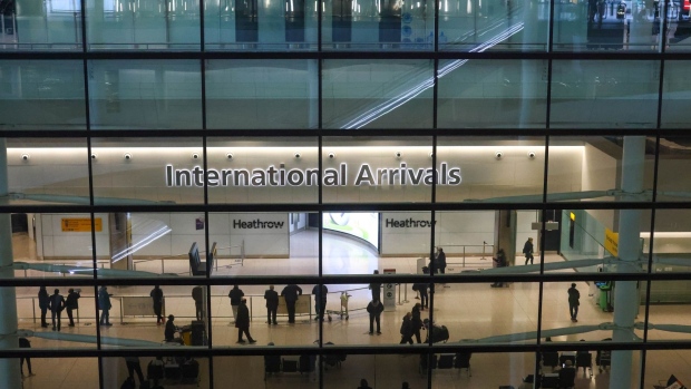 The International Arrivals area at London Heathrow Airport in London, U.K., on Monday, Jan. 18, 2021. U.K. ministers have closed travel corridors with other countries from Monday, meaning that all visitors from overseas will require a negative test result within 72 hours of travel to enter Britain. Photographer: Simon Dawson/Bloomberg