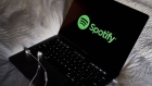 The logo for Spotify is displayed on a laptop computer in an arranged photograph taken in Little Falls, New Jersey, U.S., on Wednesday, Oct. 7, 2020. Spotify has invested hundreds of millions of dollars acquiring podcast studios such as Gimlet Media and the Ringer, hoping to attract new users and advertisers to what has been a music app. Photographer: Gabby Jones/Bloomberg