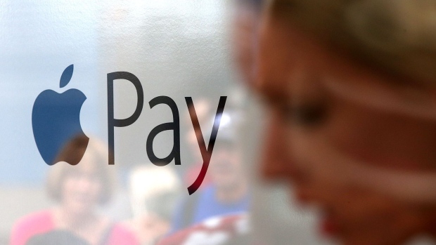 SAN FRANCISCO, CA - OCTOBER 20: The Apple Pay logo is displayed in a mobile kiosk sponsored by Visa and Wells Fargo to demonstrate the new Apple Pay mobile payment system on October 20, 2014 in San Francisco City. Apple's Apple Pay mobile payment system launched today at select banks and retail outlets. (Photo by Justin Sullivan/Getty Images) Photographer: Justin Sullivan/Getty Images North America