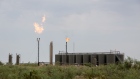 Methane gas is flared just off U.S. Route 285 near Carlsbad, New Mexico, U.S., on Tuesday, Aug. 6. 2019. New Mexico's Governor Michelle Lujan Grisham is balancing her concern over the catastrophic effects of climate change with the state's extraordinary dependence on oil and gas.