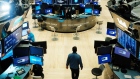 NEW YORK, NEW YORK - MARCH 20: Traders work on the floor of the New York Stock Exchange (NYSE) on March 20, 2020 in New York City