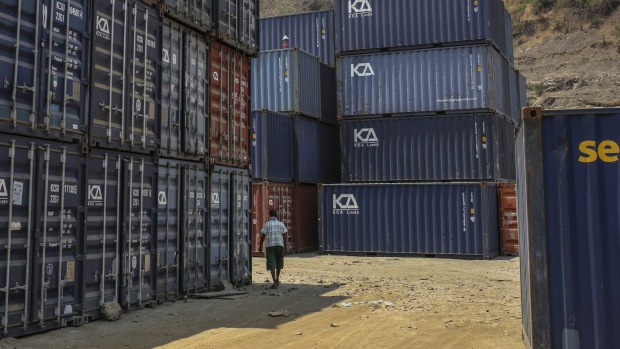 Shipping containers stand at the Jawaharlal Nehru Port, operated by Jawaharlal Nehru Port Trust (JNPT), in Navi Mumbai, Maharashtra, India, on Monday, March 30, 2020. As billions of people stay home in the the world's major economic centers, consumption of everything from transport fuel to petrochemical feedstocks is in freefall. Refiners that have already been filling up their storage tanks with unsold products now have little choice but to partially shut down their plants. Photographer: Dhiraj Singh/Bloomberg