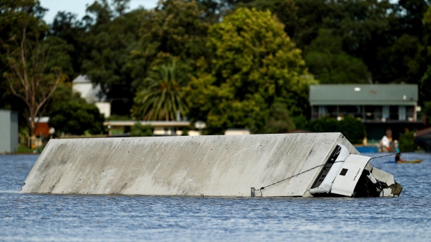 A truck trailer submerged in flood water in the suburb of McGraths Hill in Sydney, Australia, on Wednesday, March 24, 2021. European coal prices traded higher in March, squeezed by shrinking reserves and flood-related supply disruptions in Australia.