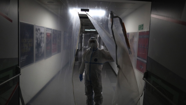 A healthcare worker in a corridor of the Covid-19 hospital set up inside the Stark Arena in Belgrade, Serbia.