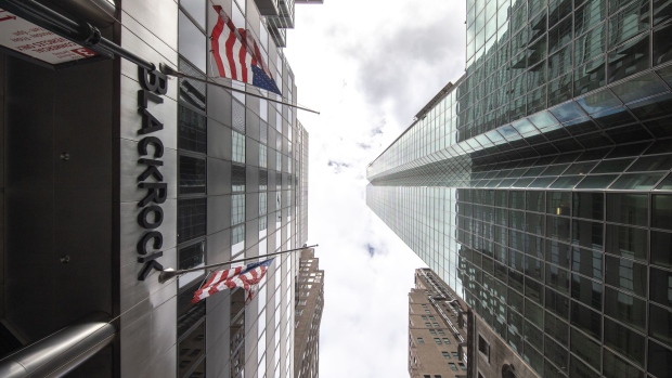 American flags fly outside BlackRock Inc. headquarters in New York, U.S, on Tuesday, April 13, 2021. BlackRock Inc. is scheduled to release earnings figures on April 15. Photographer: Jeenah Moon/Bloomberg