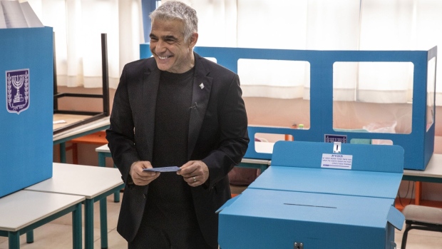 Yair Lapid casts his ballot at a polling station in Tel Aviv on March 23.
