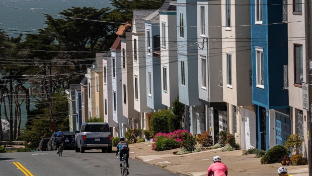 Cyclists ride past residential housing in San Francisco, California, U.S., on Friday, April 9, 2021. U.S. property taxes increased at the fastest pace for four years in 2020, with some of the steepest increases coming in traditionally low-cost Sun Belt states, according to figures from ATTOM Data Solutions. Photographer: David Paul Morris/Bloomberg