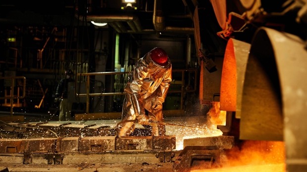 A worker wearing heat resistant protective clothing opens a furnace at the KGHM Polska Miedz SA copper smelting plant in Glogow, Poland, on Tuesday, March 9, 2021. Nickel extended its plunge from a six-year high after a stock-market slump hurt risk appetite, while copper resumed losses as supply concerns eased. Photographer: Bartek Sadowski/Bloomberg