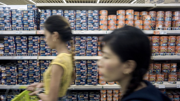 Canned food manufactured by San Miguel Corp., sits on shelves of a supermarket in Manila, the Philippines, on Sunday, April 8, 2018. San Miguel Corp., the Philippines’ largest company, expects to raise as much as $3.6 billion selling shares of its merged food and drinks unit in the fourth quarter in what could be the country’s biggest share sale on record. Photographer: Carlo Gabuco/Bloomberg