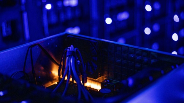 Cables inside a draw housing graphics processing units (GPU) used to mine the Ethereum and Zilliqa cryptocurrencies at the Evobits crypto farm in Cluj-Napoca, Romania, on Wednesday, Jan. 22, 2021. 