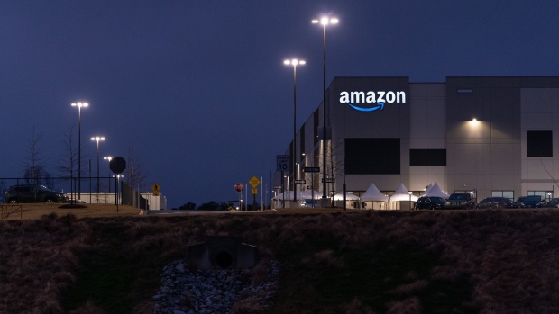 Signage outside the Amazon.com Inc. BHM1 Fulfillment Center at night in Bessemer, Alabama, U.S., on Sunday Feb. 7, 2021. The campaign in Bessemer to unionize Amazon workers has drawn national attention and is widely considered a once-in-a-generation opportunity to breach the defenses of the world’s largest online retailer, which has managed to keep unions out of its U.S. operations for a quarter-century.