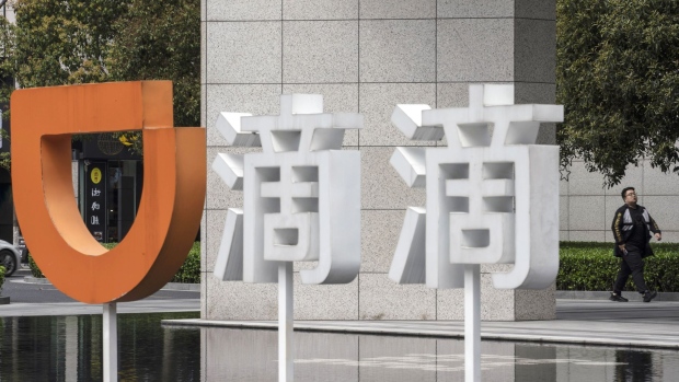 Signage outside the Didi Chuxing Technology Co. offices in Hangzhou, China, on Wednesday, March 24, 2021. Chinese ride-hailing giant Didi is accelerating plans for an initial public offering to as early as next quarter to capitalize on a post-pandemic turnaround, people familiar with its plans said. Photographer: Qilai Shen/Bloomberg