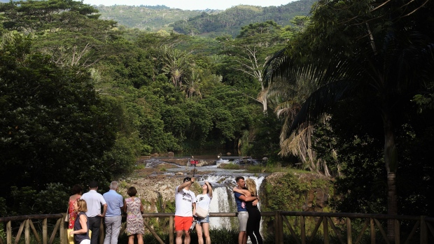 PORT LOUIS, MAURITIUS - JANUARY 31: Tourists visit Chamarel waterfall on January 31, 2020 in Chamarel, Mauritius. (Photo by Franco Origlia/Getty Images)