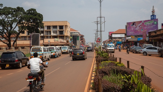 Vehicles travel along a road in Jinja, Uganda, on Friday, July 10, 2020. Engineers at Chinas CHTC Motor Co Ltd, a subsidiary of state-owned Sinomach Automobile Co Ltd., trained Kiira Motors workers, and late last year the first two prototypes of the Ugandan e-bus, called the Kayoola EVS, were completed at a military facility 115 kilometers north of Kampala. Photographer: Bloomberg/Bloomberg
