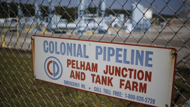 Signage is displayed on a fence at the Colonial Pipeline Co. Pelham junction and tank farm in Pelham, Alabama, U.S., on Monday, Sept. 19, 2016. Customers buying gasoline at grocery stores and other independent retailers may pay more than those shopping at name-brand outlets after the biggest gasoline pipeline in the U.S. sprung a leak in Alabama on Sept. 9. Colonial Pipeline Co. has proposed restarting the line on Sept. 22, according to the Alabama Emergency Management Agency. Photographer: Luke Sharrett/Bloomberg