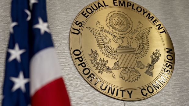 The Equal Employment Opportunity Commission (EEOC) seal hangs inside a hearing room at the headquarters in Washington, D.C., U.S., on Tuesday, Feb. 18, 2020. The Trump administration wants to cut fiscal year 2021 spending on the Labor Department, National Labor Relations Board, and EEOC, reviving previous belt-tightening bids that have not been approved by Congress. Photographer: Andrew Harrer/Bloomberg