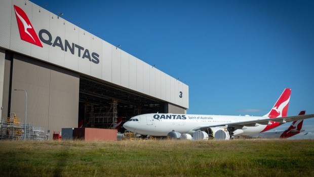 Grounded Qantas Airways Ltd. aircraft stand outside a hangar at Brisbane Airport in Brisbane, Australia, on Tuesday, June 9, 2020. Coronavirus-related travel restrictions have put enormous pressure on airlines globally, and none are certain about how the future will pan out as new travel requirements come into force and travelers' attitudes change. Photographer: Ian Waldie/Bloomberg