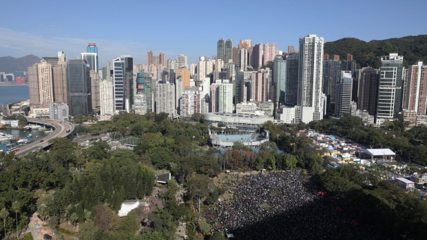 Demonstrators gather during a protest at Victoria Park in the Causeway Bay district of Hong Kong, China, on Sunday, Dec. 8, 2019. Tens of thousands of people gathered in Hong Kong's Victoria Park for a march to the Central business district as massive crowds clogged surrounding streets as they waited to enter the venue. Photographer: Kyle Lam/Bloomberg