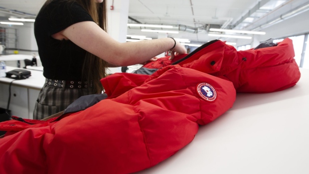 An employee checks a finished jacket at the new Canada Goose Inc. manufacturing facility in Montreal, Quebec, Canada, on Monday, April 29, 2019. The facility is Canada Goose's second factory in Quebec and eighth wholly-owned facility in Canada.