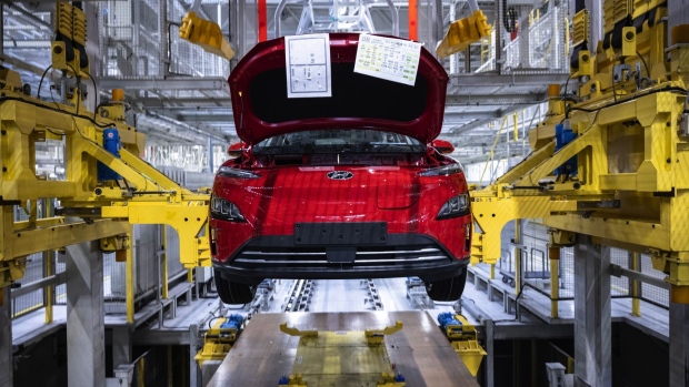 A Hyundai Kona electric sport utility vehicle (SUV) in a cradle on the assembly line at the Hyundai Motor Co. plant in Nosovice, Czech Republic, on Wednesday, April 7, 2021. With Europe expected to lead the world in electric-car sales for a second straight year, an epic rush to build a battery-supply chain from scratch is playing out across the continent. Photographer: Milan Jaros/Bloomberg