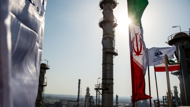 An Iranian national flag flies above the new Phase 3 facility at the Persian Gulf Star Co. (PGSPC) gas condensate refinery in Bandar Abbas, Iran, on Wednesday, Jan. 9. 2019. The third phase of the refinery begins operations next week and will add 12-15 million liters a day of gasoline output capacity to the plant, Deputy Oil Minister Alireza Sadeghabadi told reporters. Photographer: Ali Mohammadi/Bloomberg