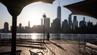 A person stands in front of a view of One World Trade Center along the waterfront in Jersey City, New Jersey, U.S., on Monday, April 5, 2021. U.S. futures edged higher while most Asian stocks climbed as investors digested Friday’s unexpectedly strong jobs report. Photographer: Michael Nagle/Bloomberg