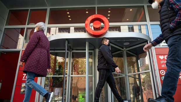 Pedestrians wearing protective masks pass in front of a Target Corp. store in San Francisco, California, U.S., on Monday, Mar. 1, 2021. Target Corp. is scheduled to release earnings figures on March 2.