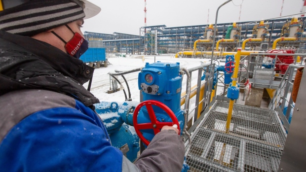 A worker adjusts a pipeline valve at the Gazprom PJSC Slavyanskaya compressor station, the starting point of the Nord Stream 2 gas pipeline, in Ust-Luga, Russia, on Thursday, Jan. 28, 2021. Nord Stream 2 is a 1,230-kilometer (764-mile) gas pipeline that will double the capacity of the existing undersea route from Russian fields to Europe -- the original Nord Stream -- which opened in 2011. Photographer: Andrey Rudakov/Bloomberg