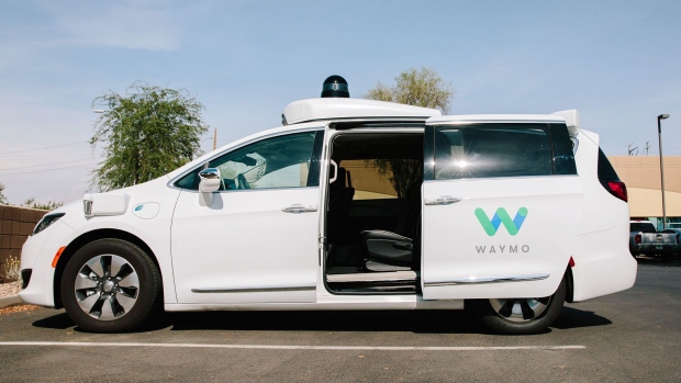 A Waymo LLC Chrysler Pacifica autonomous vehicle sits parked in Chandler, Arizona, U.S., on Monday, July 30, 2018. The Google offshoot is tinkering with pricing and finalizing its business model for autonomous vehicles, which includes a new effort to boost public transit. Photographer: Caitlin O'Hara/Bloomberg
