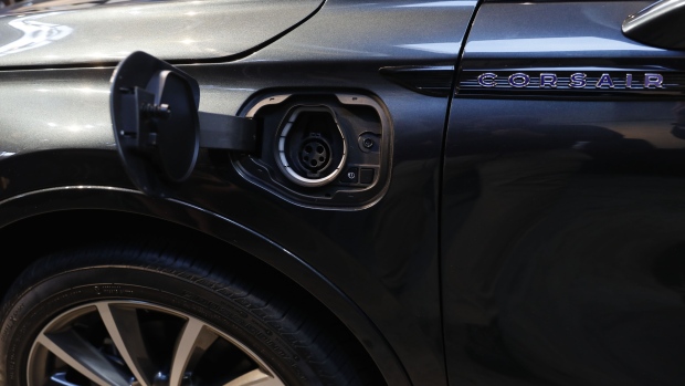The plug-in electric hybrid charging port of a Ford Motor Co. Lincoln brand 2020 Corsair Grand Touring hybrid sports utility vehicle (SUV) is seen during a reveal event ahead of the Los Angeles Auto Show in Los Angeles, California, U.S., on Monday, Nov. 18, 2019. Ford's Lincoln luxury line is getting in on the electrification trend with a plug-in hybrid version of its Corsair compact sport utility vehicle. Photographer: Patrick T. Fallon/Bloomberg