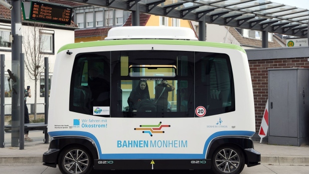 MONHEIM, GERMANY - FEBRUARY 25: An almost fully autonomous electric mini bus, without a driver, drives through the streets on the two-kilometer route between the bus station and the old town on February 25, 2021 in Monheim, Germany. The e-bus fleet is powered with 100% green electricity. (Photo by Andreas Rentz/Getty Images)