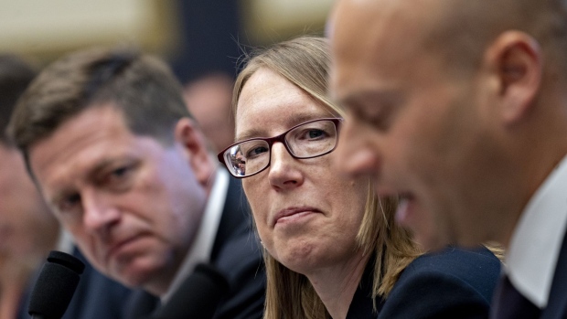 Hester Peirce, commissioner of the U.S. Securities and Exchange Commission (SEC), center, listens during a House Financial Services Committee hearing in Washington, D.C., U.S., on Tuesday, Sept. 24, 2019. The head of the SEC said this month his agency and other regulators are keeping taps on emerging risks in the fast-growing corporate debt market, highlighting assets that could he susceptible to liquidity shocks.