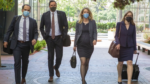 Elizabeth Holmes, founder and former chief executive officer of Theranos Inc., center right, arrives at U.S. federal court in San Jose, California, U.S., on Thursday May 6, 2021.