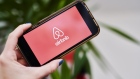 AirBnb Inc. signage is displayed on an smartphone in an arranged photograph taken in the Brooklyn borough of New York, U.S., on Friday, April 17, 2020. Home-sharing leader Airbnb Inc. lined up $1 billion in debt boosting a financial cushion it can use to grow and pay bills as the global coronavirus pandemic crushes demand for travel and diminishes the prospect of an initial public offering. Photographer: Gabby Jones/Bloomberg