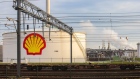 Railway wagon bogies beside a Royal Dutch Shell Plc logo on an oil silo at the Shell Pernis refinery in Rotterdam, Netherlands, on Tuesday, April 27, 2021. Shell reports first quarter earnings on April 29. Photographer: Peter Boer/Bloomberg