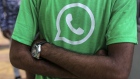 The Facebook Inc. WhatsApp logo is displayed on a green t-shirt during a roadshow for the messaging service and Reliance Jio Infocomm Ltd.'s wireless network in Pune, India, on Thursday, Oct. 25, 2018. Facebook and Reliance Jio are teaming up to draw hordes of customers with cheap phones, rock-bottom rates and handy messaging services. Photographer: Dhiraj Singh/Bloomberg