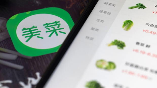 An icon for the Meicai application is displayed on a tablet in an arranged photograph taken in Hong Kong, China, on Thursday, Jan. 11, 2018. Meicai, a China startup that helps farmers sell vegetables to restaurants, has raised $450 million in a funding round led by Tiger Global Management and China Media Capital, according to people familiar with the matter.