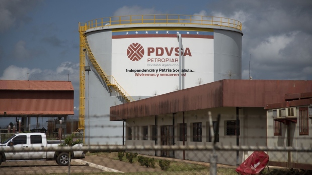 An oil tank stands at the Petroleos de Venezuela SA (PDVSA) Petropiar facility in El Tigre, Venezuela, on Sunday, Oct. 14, 2018. State-owned PDVSA doesn't publish statistics, but environmentalists and analysts keep seemingly endless lists of examples of wayward crude - unleashed by busted valves, ripped gaskets, and cracked pipes - that they say has polluted waterways and farmland and probably has seeped into the nation's aquifers.