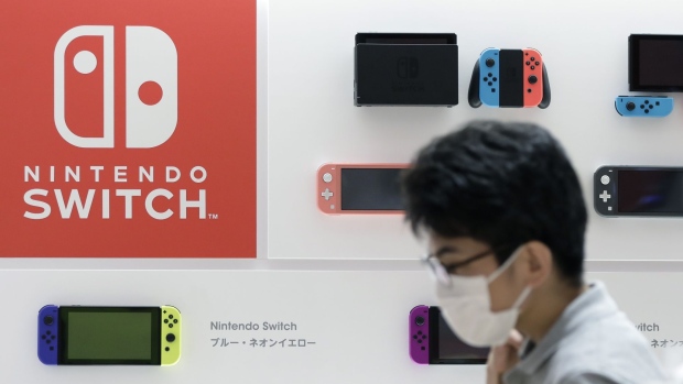 Nintendo Co. Switch game consoles, top, and Switch Lite game consoles are displayed inside the Nintendo TOKYO store during a media tour in Tokyo, Japan, on Tuesday, Nov. 19, 2019. Nintendo's first official store in Japan is due to open in the Shibuya Parco department store, operated by Parco Co., when it re-opens on Nov. 22.