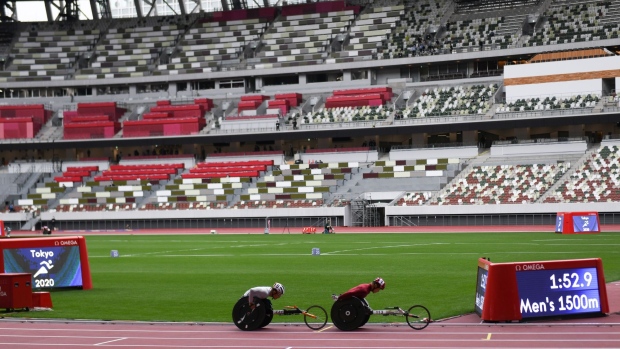Athletes position at the start line during a para athletics test event for the Tokyo 2020 Paralympic Games at the National Stadium in Tokyo, Japan, on Tuesday, May 11, 2021. Japan’s government is determined to go ahead with the Olympic and Paralympic events, despite rising infection numbers and parts of the world still struggling to get the pandemic under control. Photographer: Noriko Hayashi/Bloomberg
