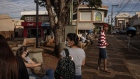 Pedestrians walk in front of a church in Serrana, Brazil, on Wednesday, May 26, 2021. The small town of 46,000, where the virus has been twice as deadly as in its neighbors, was chosen for a study researchers say is the first of its kind in the
