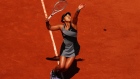 PARIS, FRANCE - MAY 30: Naomi Osaka of Japan serves in her First Round match against Patricia Maria Tig of Romania during Day One of the 2021 French Open at Roland Garros on May 30, 2021 in Paris, France. (Photo by Julian Finney/Getty Images)